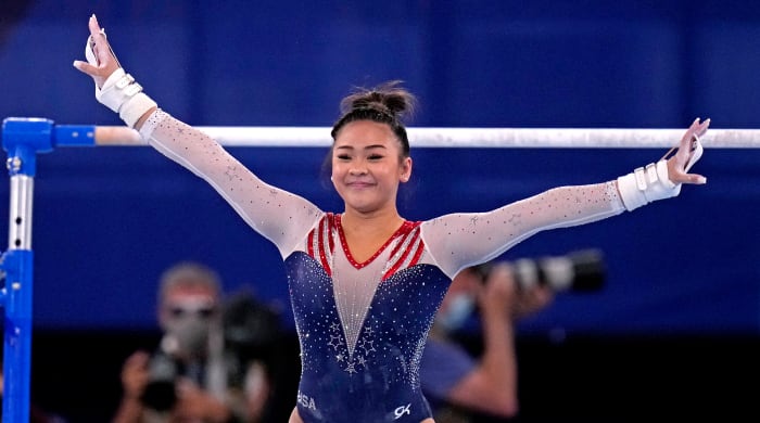 Suni Lee competing at the Olympics.